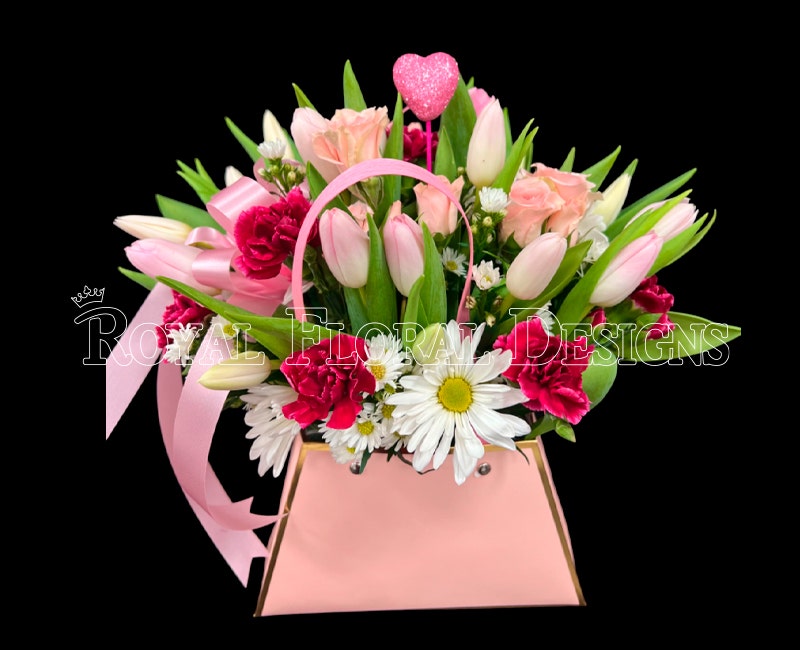 Bright mix of tulips, daisies and roses in a blush hat box
