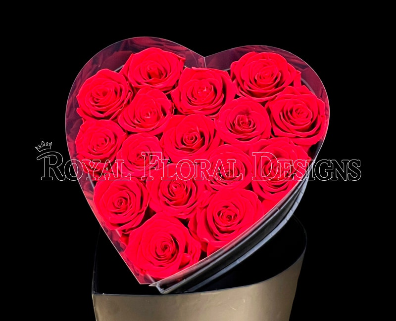Red roses in a heart-shaped Love and Romance box