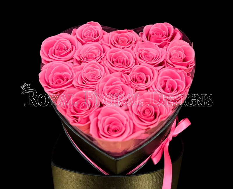 Pink roses in a heart-shaped box