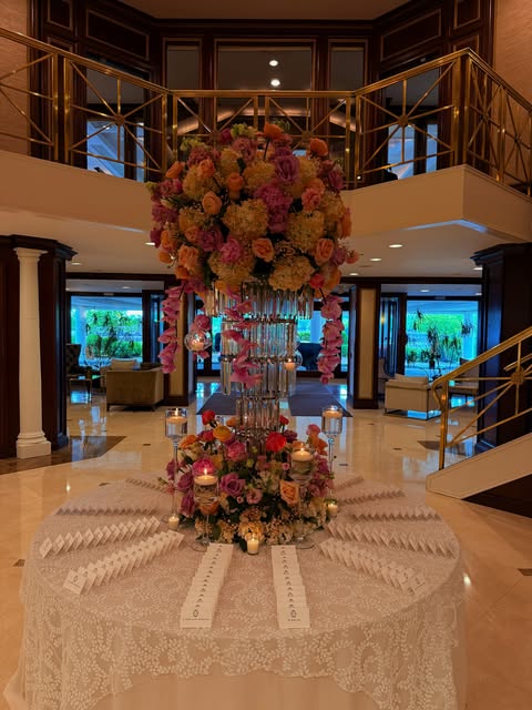 Towering rose centerpiece in a grand hotel atrium
